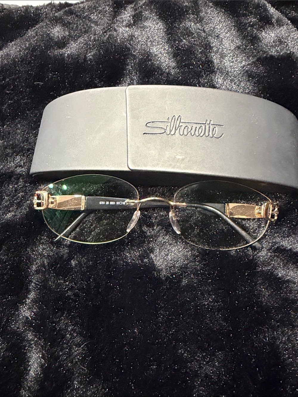 Silhouette Rimless Gold Eyeglasses with Green-Tinted Lenses